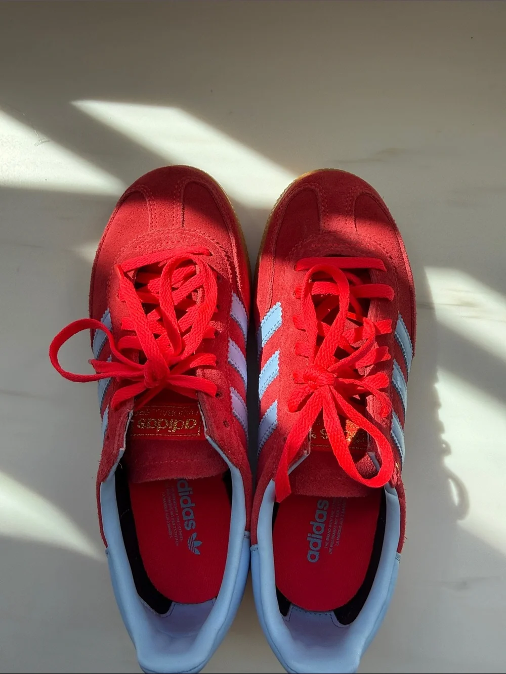 Women’s Red Adidas Spezial Sneakers with Light Blue Stripes